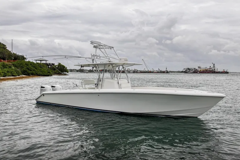 Slide: The Image of 2006 Venture Center Console boat on water, cloudy sky background. - 5