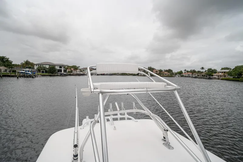 Slide: The Image of 2006 Venture Center Console boat on a calm waterway under cloudy skies. - 54