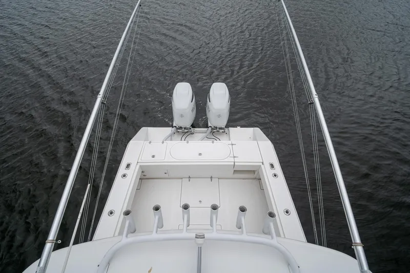 Slide: The Image of 2006 Venture Center Console boat with dual engines on water. - 60