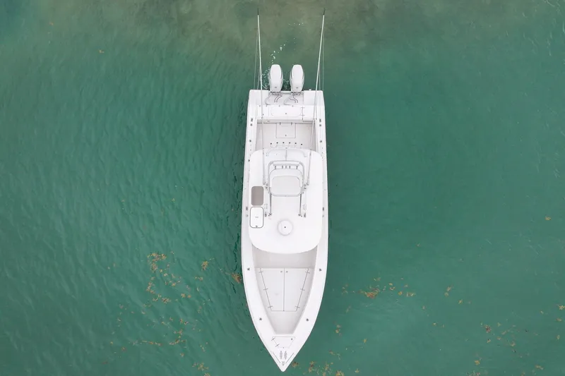 Slide: The Image of Aerial view of 2006 Venture Center Console boat on turquoise water. - 8