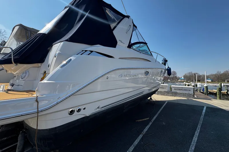 Slide: The Image of 2007 Monterey 330 Sport Yacht docked, featuring sleek design and covered deck. - 1