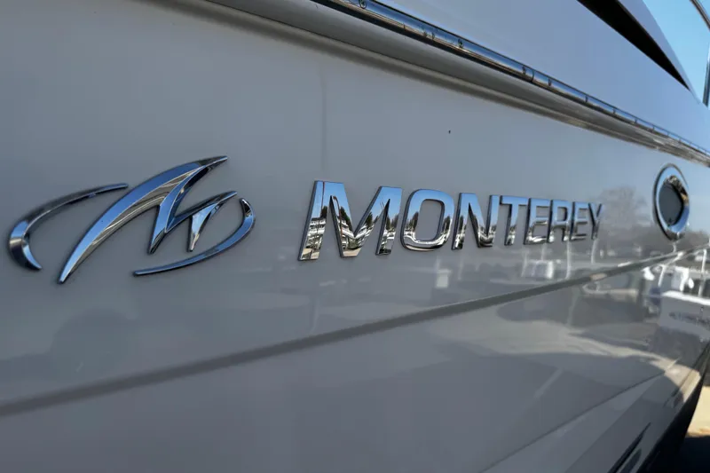 Slide: The Image of Close-up of 2007 Monterey 330 Sport Yacht logo on hull. - 13