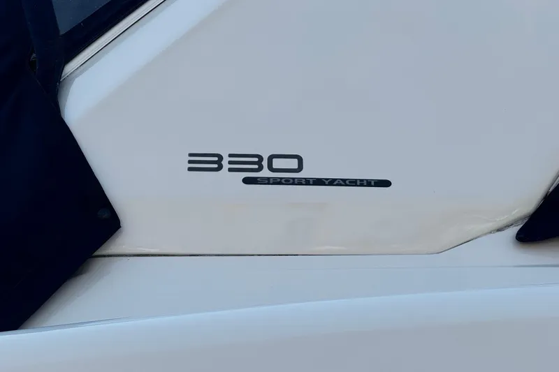 Slide: The Image of 2007 Monterey 330 Sport Yacht logo on white surface. - 14