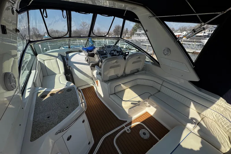 Slide: The Image of 2007 Monterey 330 Sport Yacht interior with white seating and wood flooring. - 15