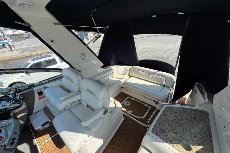 Slide: The Image of Luxurious interior of a 2007 Monterey 330 Sport Yacht with plush seating and sleek design. - 16