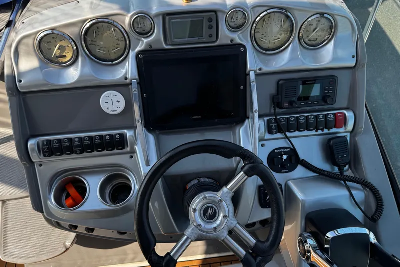 Slide: The Image of Dashboard of a 2007 Monterey 330 Sport Yacht with gauges and controls. - 19