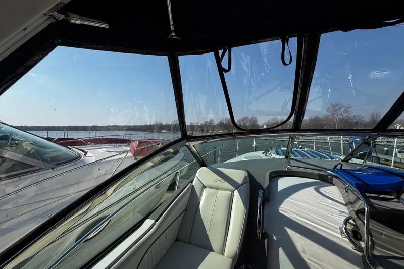Slide: The Image of Interior view of a 2007 Monterey 330 Sport Yacht with marina backdrop. - 20