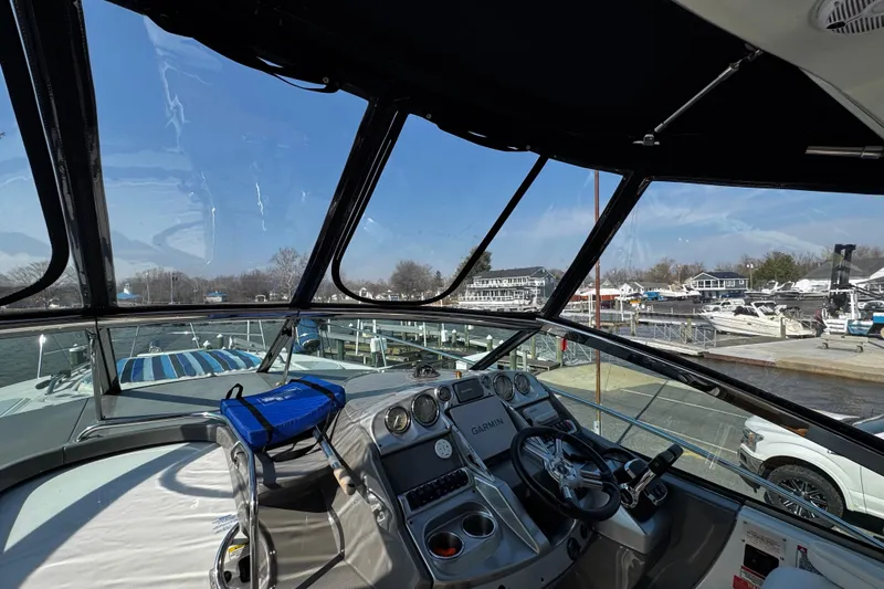 Slide: The Image of Cockpit view of 2007 Monterey 330 Sport Yacht at marina, featuring Garmin navigation system. - 21
