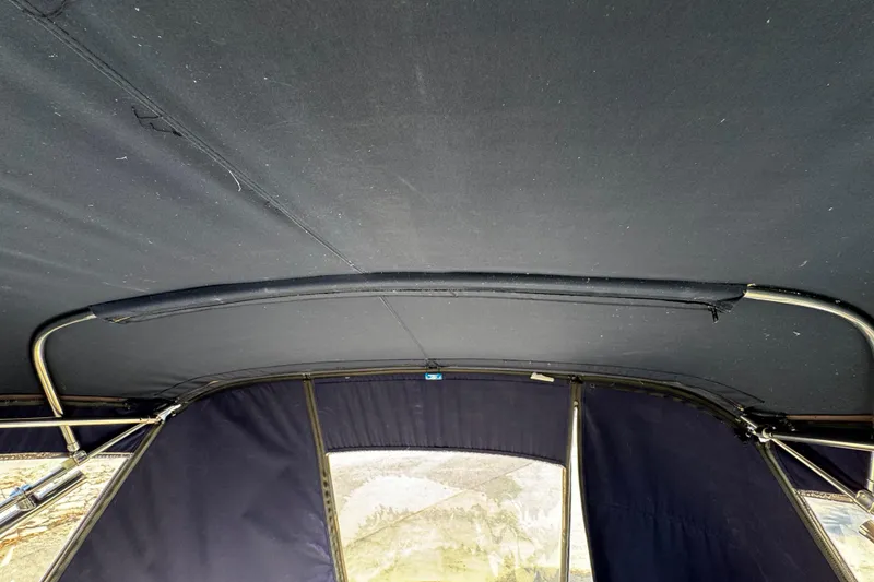 Slide: The Image of Interior view of a 2007 Monterey 330 Sport Yacht canopy with metal frame. - 22