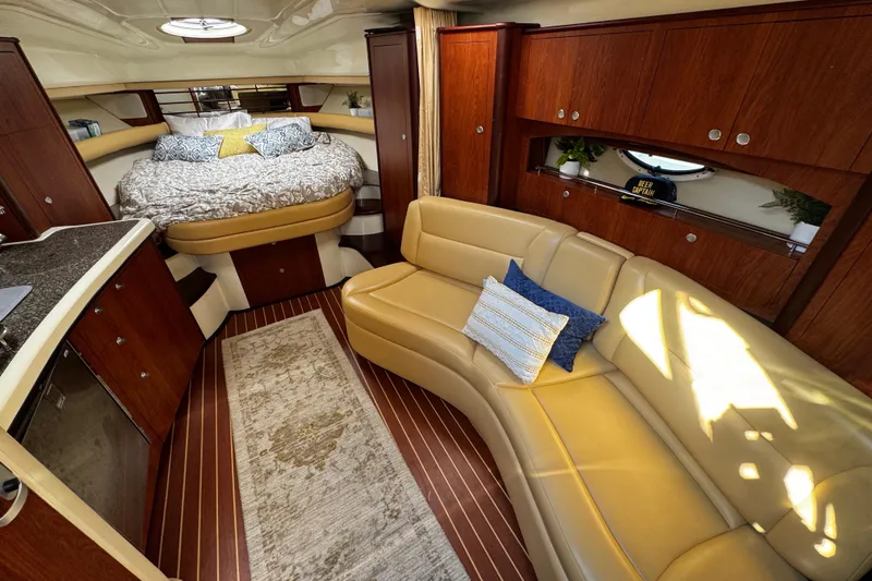Slide: The Image of Luxurious interior of a 2007 Monterey 330 Sport Yacht with cozy seating and elegant wood finishes. - 23