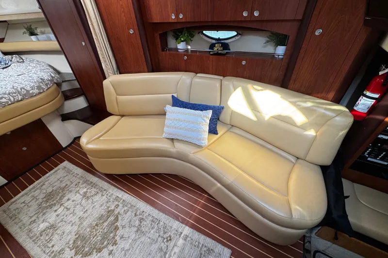 Slide: The Image of Luxurious interior of 2007 Monterey 330 Sport Yacht with beige leather seating and decorative pillows. - 24