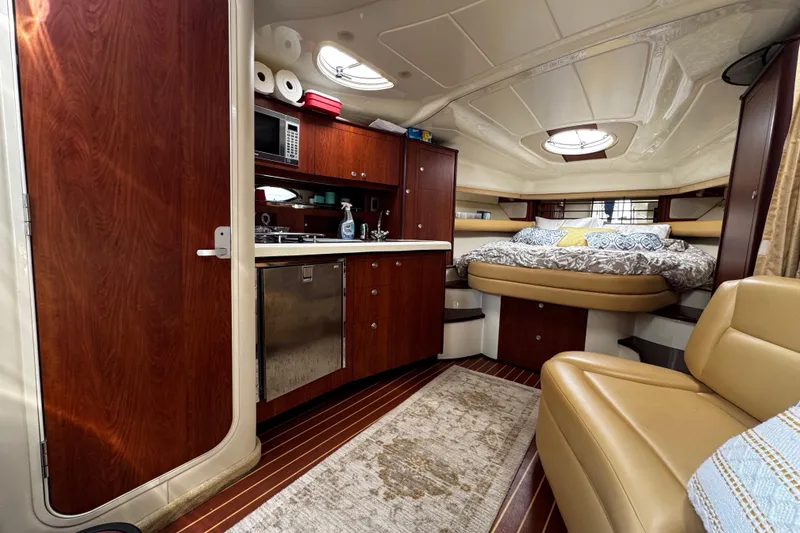 Slide: The Image of Luxurious interior of a 2007 Monterey 330 Sport Yacht with cozy bed and kitchenette. - 29