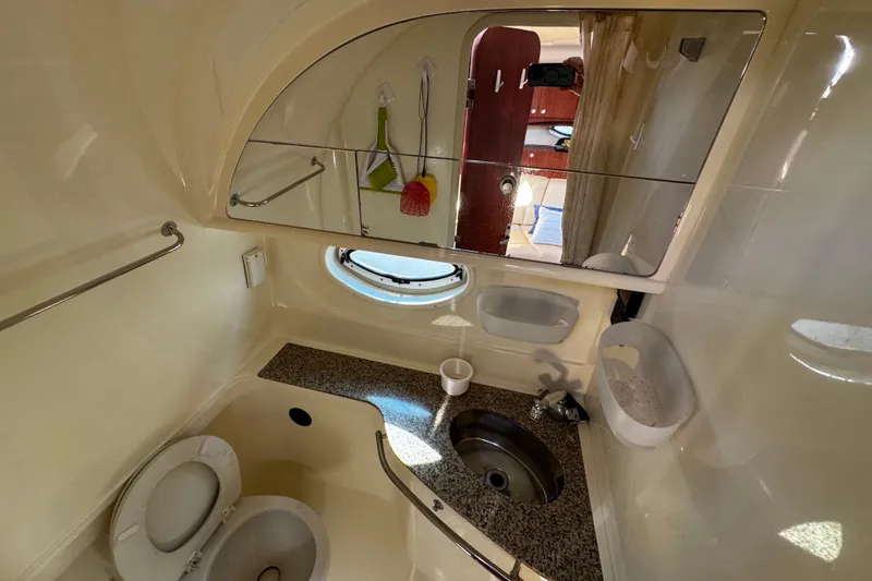 Slide: The Image of Bathroom interior of a 2007 Monterey 330 Sport Yacht with sink and toilet. - 30