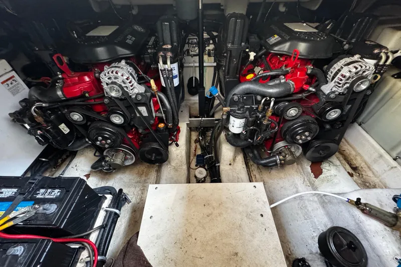 Slide: The Image of Engine compartment of a 2007 Monterey 330 Sport Yacht, showcasing dual engines and components. - 32