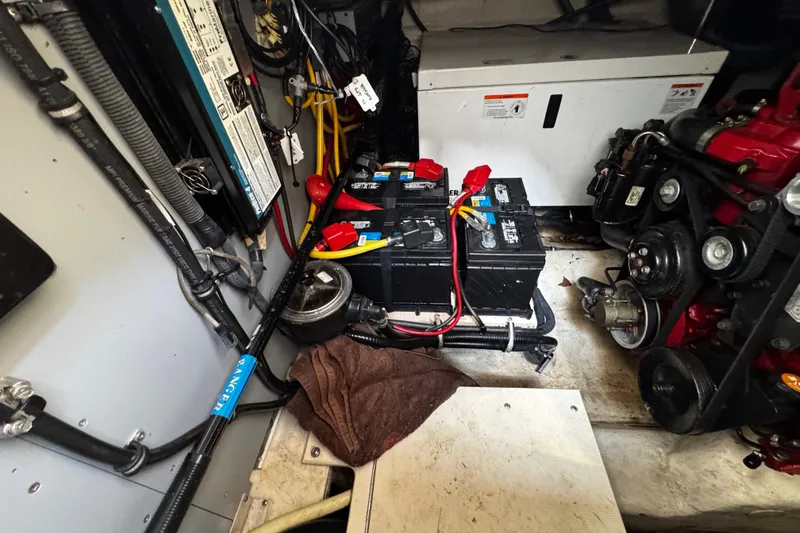 Slide: The Image of Engine compartment of a 2007 Monterey 330 Sport Yacht with batteries and wiring. - 38