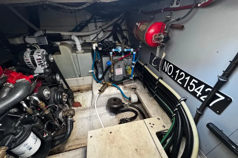 Slide: The Image of Engine room of a 2007 Monterey 330 Sport Yacht with visible components and wiring. - 39