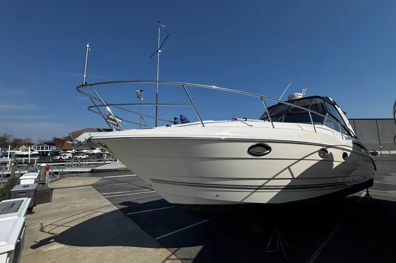 Slide: The Image of 2007 Monterey 330 Sport Yacht on display in a marina under clear blue skies. - 4