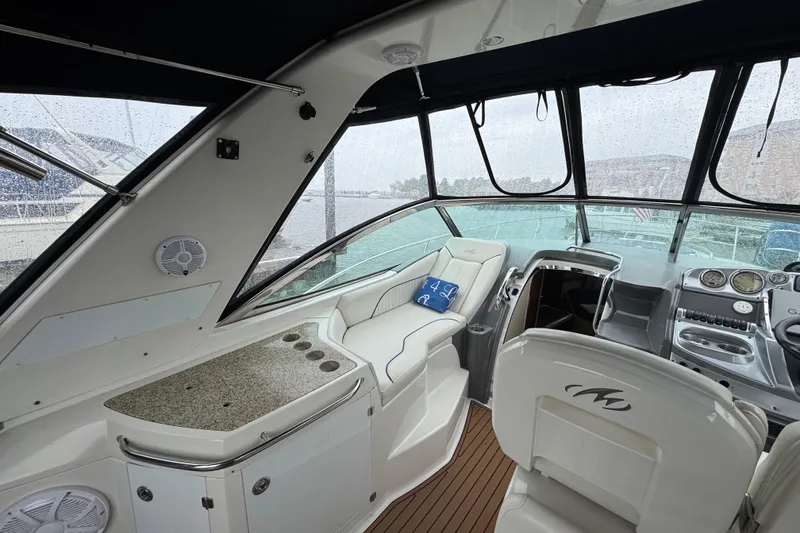 Slide: The Image of Interior of a 2007 Monterey 330 Sport Yacht with sleek seating and modern dashboard. - 40