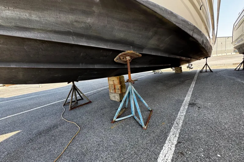 Slide: The Image of Bottom view of a 2007 Monterey 330 Sport Yacht on stands in a parking lot. - 7
