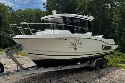 Slide: The Image of 2018 Jeanneau NC Sport 795 boat on trailer outdoors. - 3