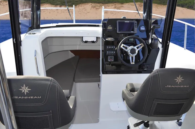 Slide: The Image of Manufacturer Provided Image: 2018 Jeanneau NC Sport 795 cockpit with steering wheel and seating. - 7