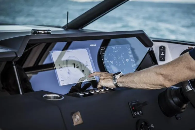 Slide: The Image of Touchscreen dashboard of 2027 Axopar 37 Sun-Top boat, displaying navigation and control systems. - 4