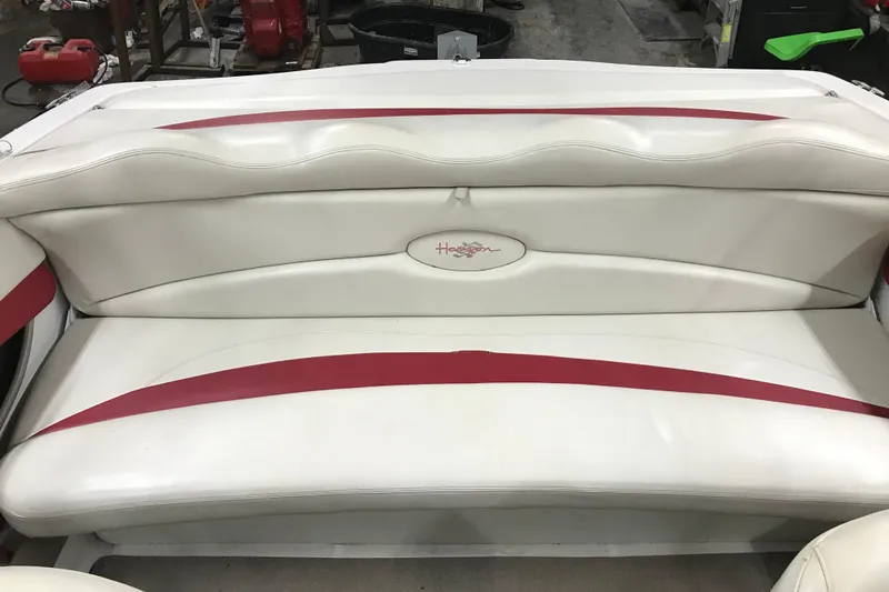 Slide: The Image of White and red seating of a 2002 Four Winns 180 Horizon boat. - 10
