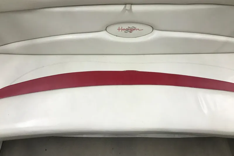 Slide: The Image of White and red seating of a 2002 Four Winns 180 Horizon boat. - 11