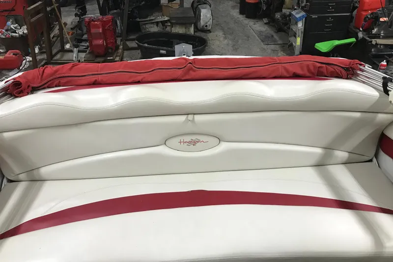 Slide: The Image of 2002 Four Winns 180 Horizon boat interior with white and red seating. - 22