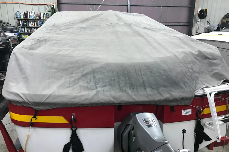 Slide: The Image of Covered 2002 Four Winns 180 Horizon boat in a garage setting. - 26