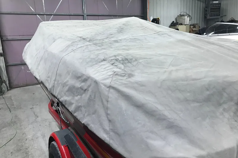 Slide: The Image of Covered 2002 Four Winns 180 Horizon boat in garage setting. - 28