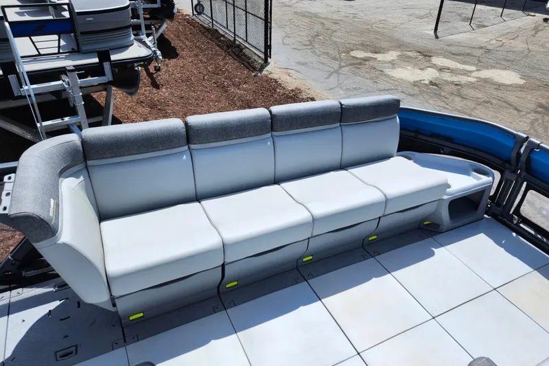 Slide: The Image of 2023 Sea-Doo Switch Cruise 21 boat seating area with gray cushioned bench. - 13