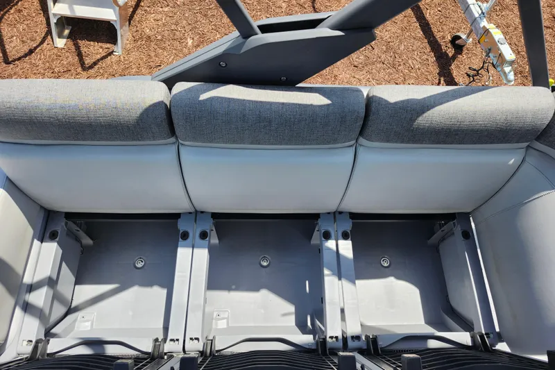 Slide: The Image of 2023 Sea-Doo Switch Cruise 21 seating area with storage compartments. - 22