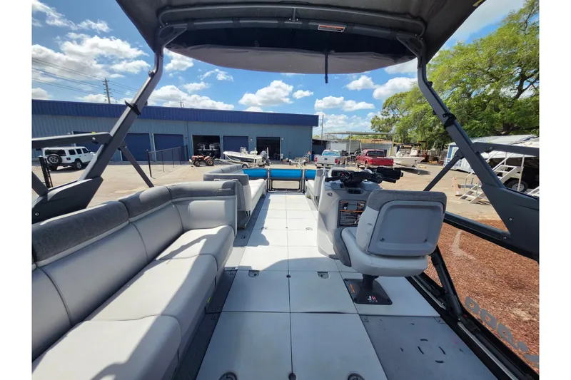 Slide: The Image of 2023 Sea-Doo Switch Cruise 21 interior with spacious seating and modern controls. - 25