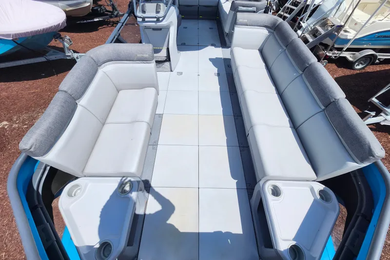 Slide: The Image of 2023 Sea-Doo Switch Cruise 21 interior with spacious seating and cup holders. - 9