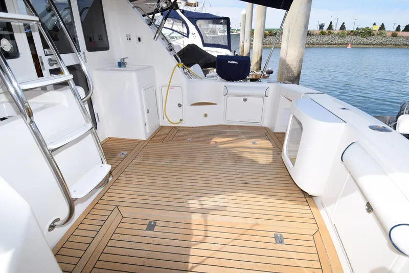Slide: The Image of 2005 Riviera 33 Open Flybridge yacht with spacious teak deck and modern amenities. - 25