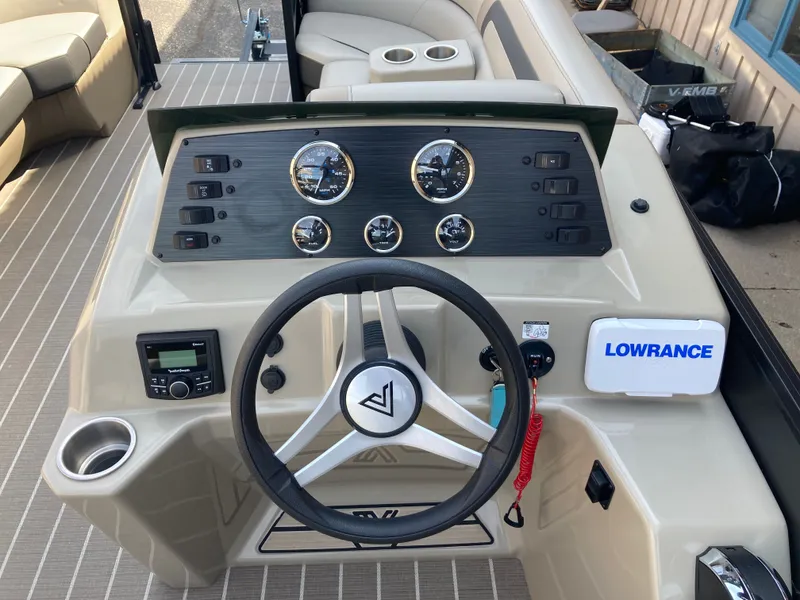 Slide: The Image of Viaggio Lago 22R 2023 helm with gauges and Lowrance display. - 14