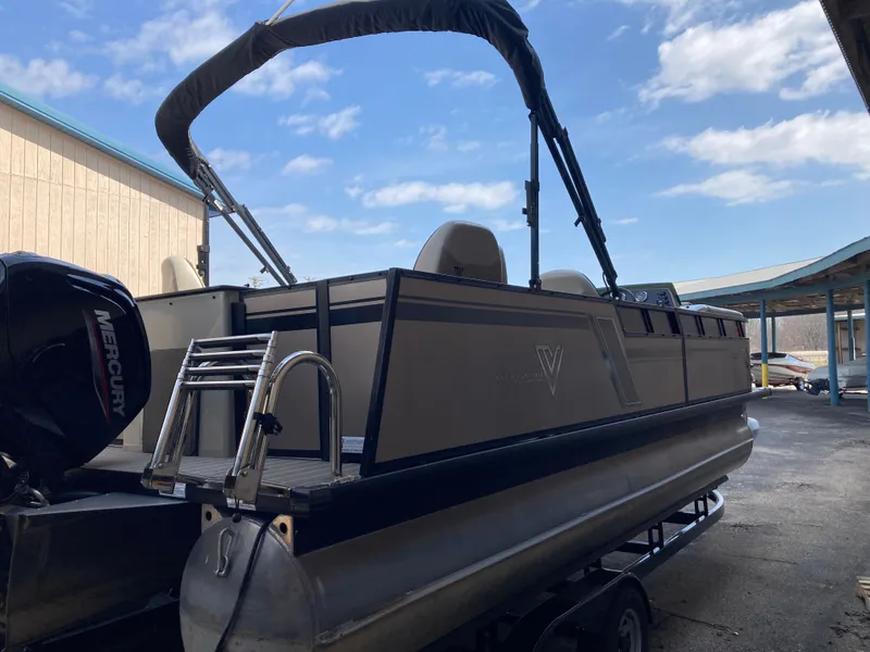 Slide: The Image of Viaggio Lago 22R pontoon boat 2023 with Mercury engine outdoors. - 5