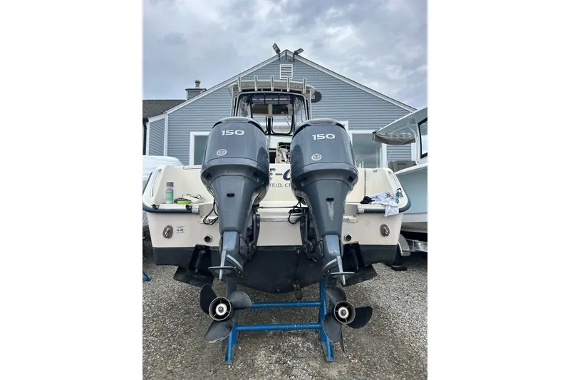 Slide: The Image of 2002 Grady-White Islander 270 boat with dual 150 horsepower outboard engines. - 12