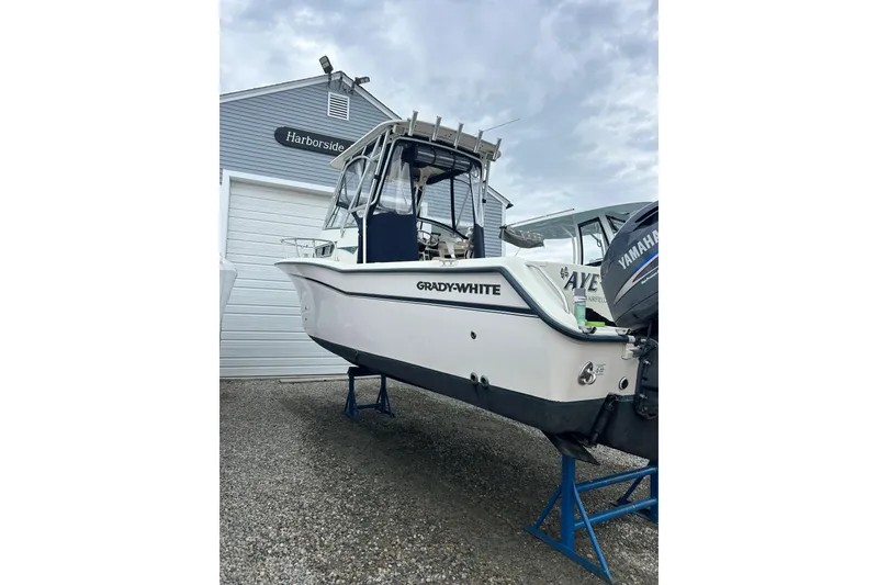 Slide: The Image of 2002 Grady-White Islander 270 boat on stands, near Harborside building. - 2