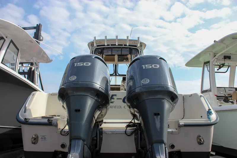 Slide: The Image of 2002 Grady-White Islander 270 boat with twin 150 horsepower outboard engines. - 3