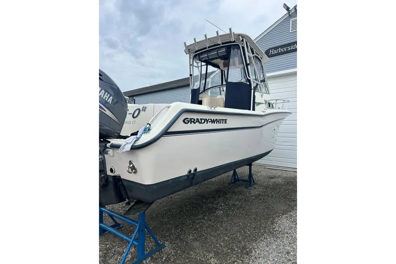 Slide: The Image of 2002 Grady-White Islander 270 boat on stands, featuring Yamaha outboard motor. - 4