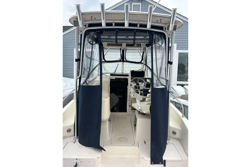 Slide: The Image of 2002 Grady-White Islander 270 boat interior with helm and seating area. - 5