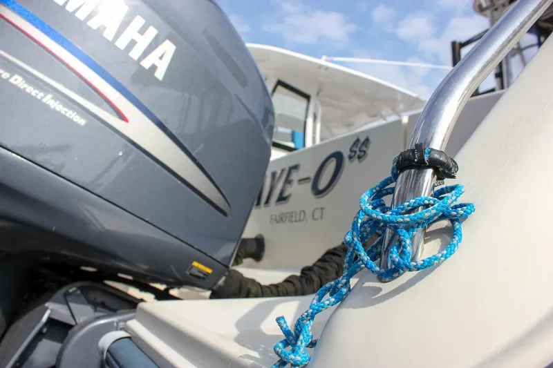 Slide: The Image of 2002 Grady-White Islander 270 boat with Yamaha engine and blue rope detail. - 8