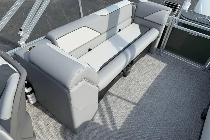 Slide: The Image of Luxurious seating on 2026 Avalon Venture Quad Lounge pontoon boat, featuring sleek gray upholstery. - 10
