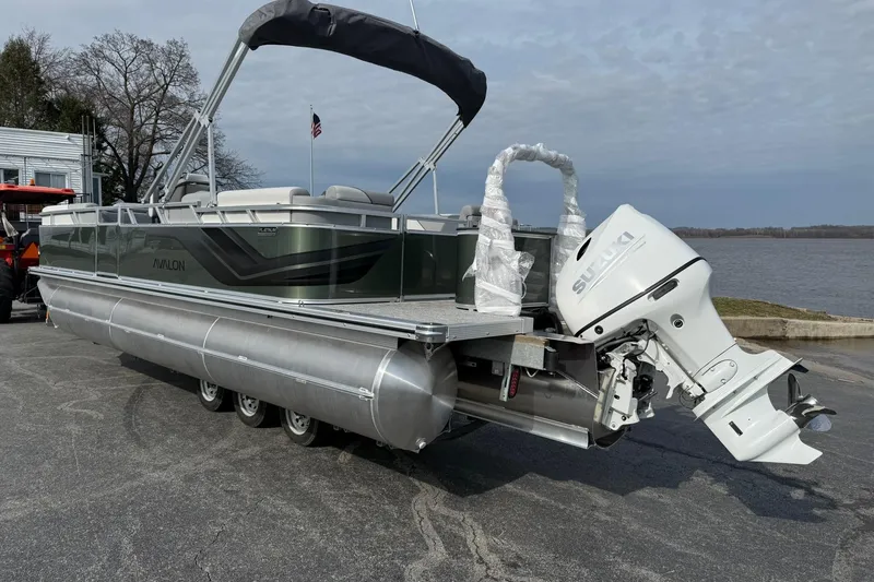 Slide: The Image of 2026 Avalon Venture Quad Lounge 23' pontoon boat with Suzuki outboard motor. - 3