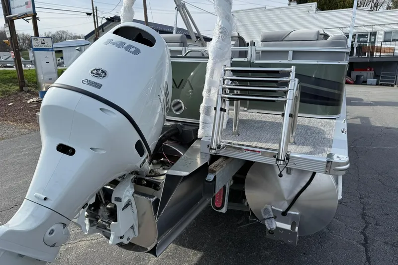 Slide: The Image of 2026 Avalon Venture Quad Lounge 23' boat with powerful 140 HP outboard motor. - 4