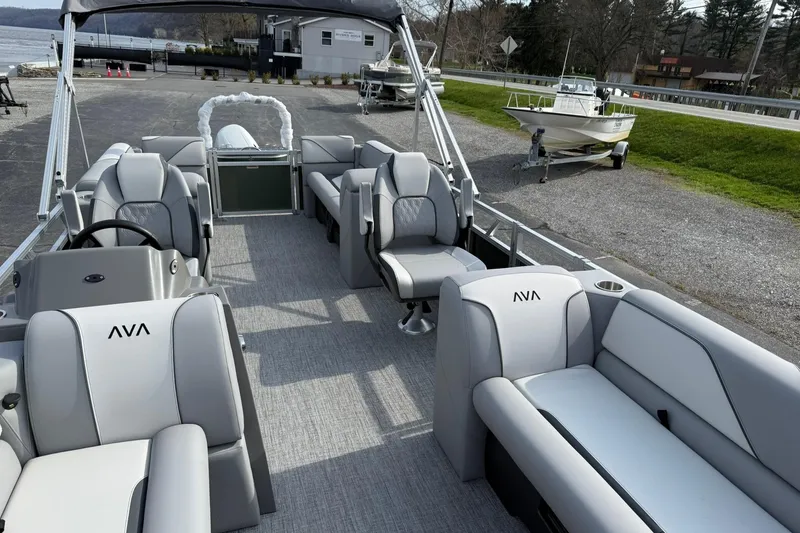 Slide: The Image of 2026 Avalon Venture Quad Lounge 23' pontoon boat with spacious seating and modern design. - 8