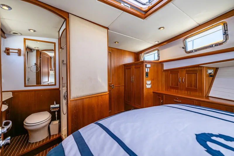 Slide: The Image of Luxurious 2006 Grand Banks 47 Europa yacht interior with wood finish and modern amenities. - 13