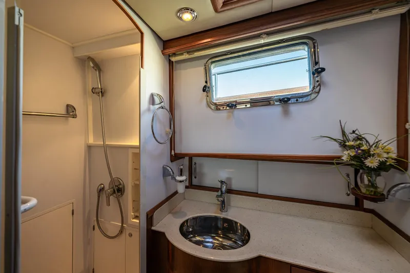 Slide: The Image of Luxurious bathroom in 2006 Grand Banks 47 Europa yacht with shower and sink. - 15